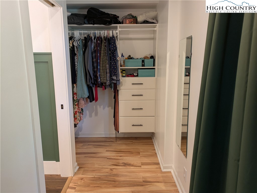 399 Ravens Ridge Circle Boone, NC 28607 - Photo 16 of 42 a view of walk in closet with clothes and shoes