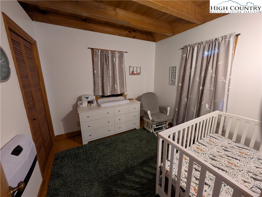 399 Ravens Ridge Circle Boone, NC 28607 - Photo 21 of 42 a view of a bedroom with furniture and staircase