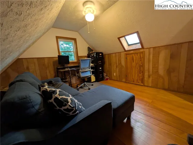 a room with furniture and wooden floor