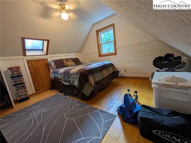 a bed room with a bed and a lamp