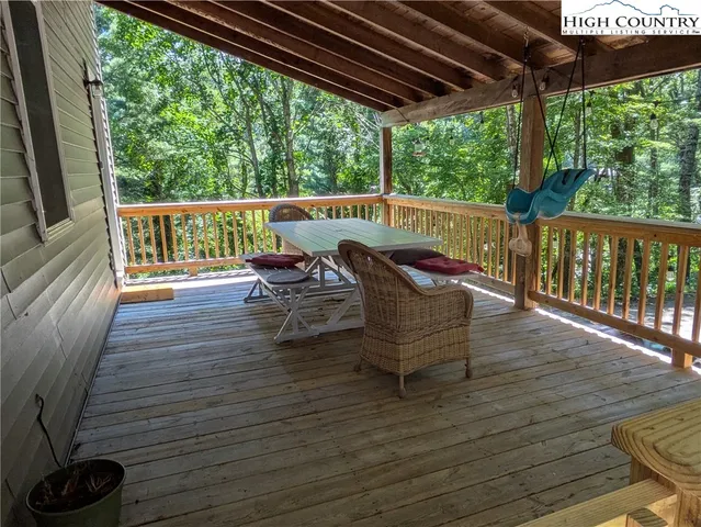 a view of sitting area with furniture and wooden floor