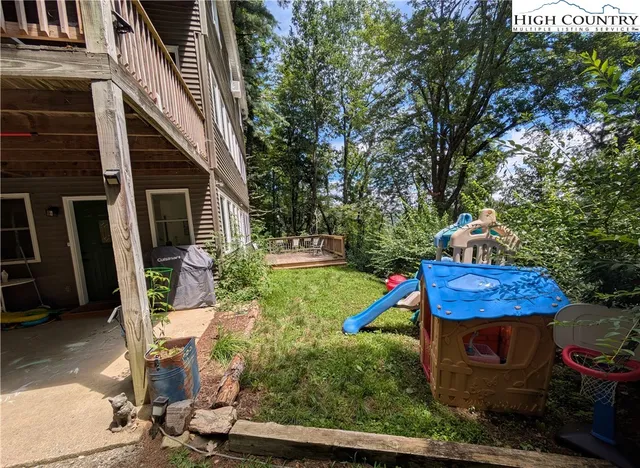 a backyard of a house with outdoor seating