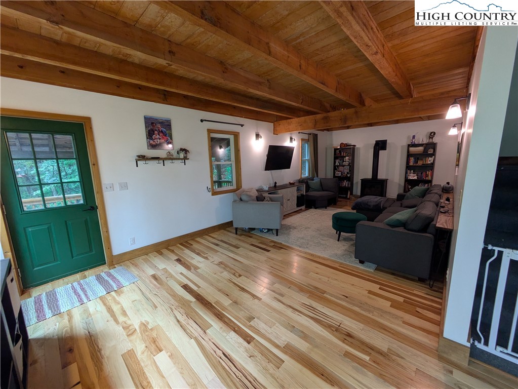 399 Ravens Ridge Circle Boone, NC 28607 - Photo 4 of 42 a bed room with furniture and a flat screen tv