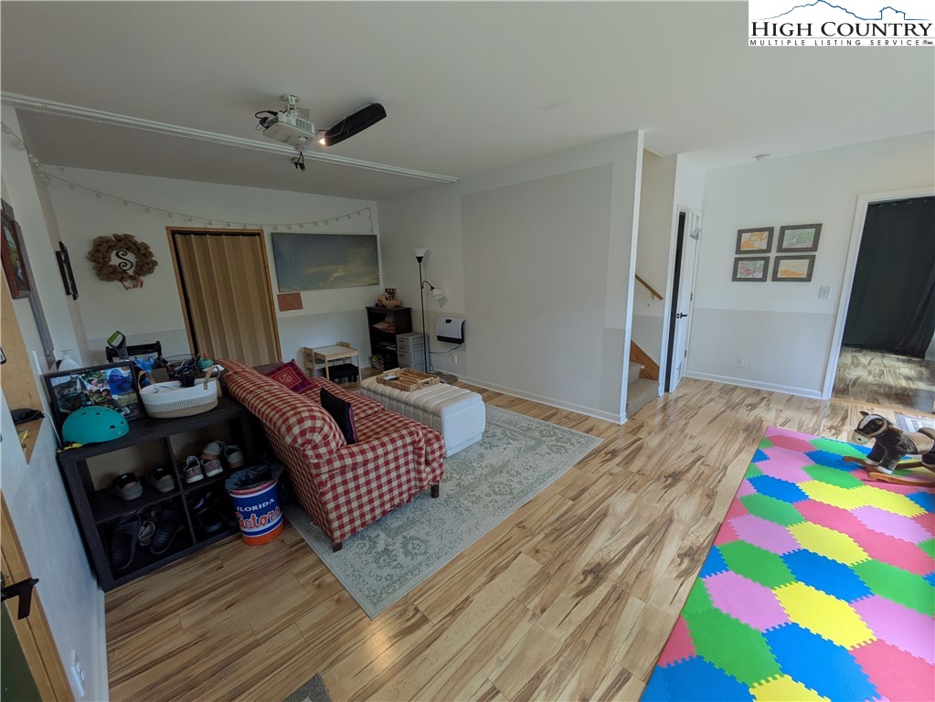 399 Ravens Ridge Circle Boone, NC 28607 - Photo 8 of 42 a living room with furniture and a flat screen tv