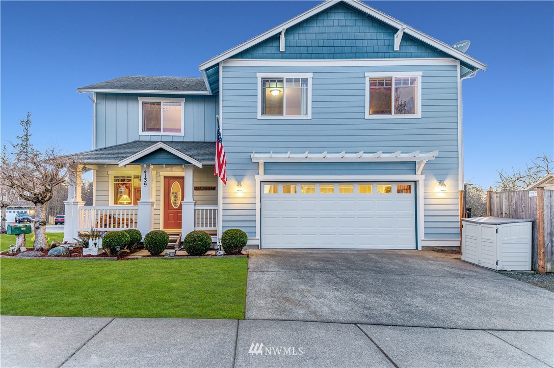 4139 Track Street Bellingham, WA 98226 - Photo 1 of 40 a front view of a house with a yard and garage