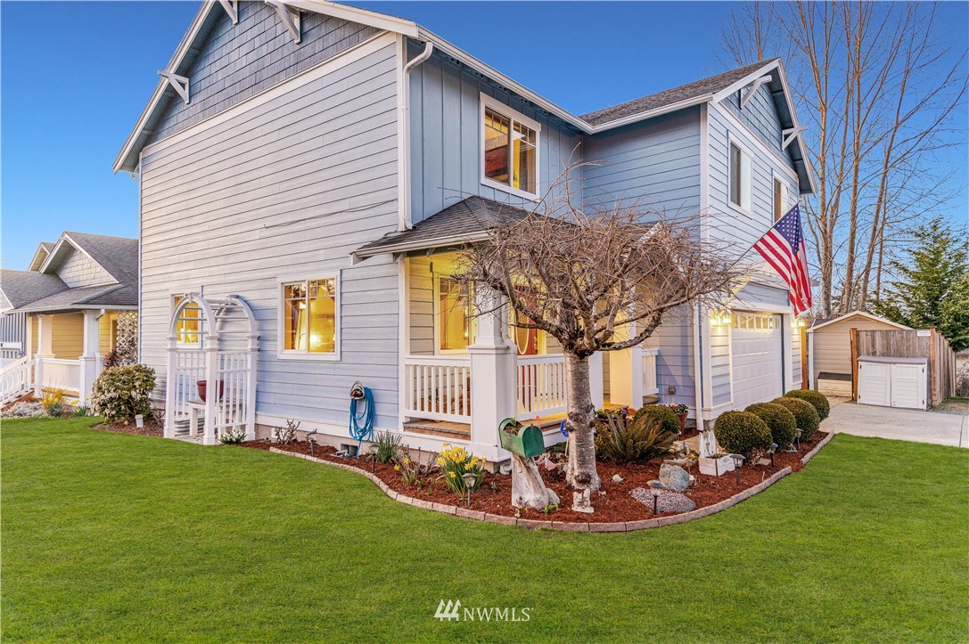 4139 Track Street Bellingham, WA 98226 - Photo 2 of 40 a front view of a house with a yard table and chairs
