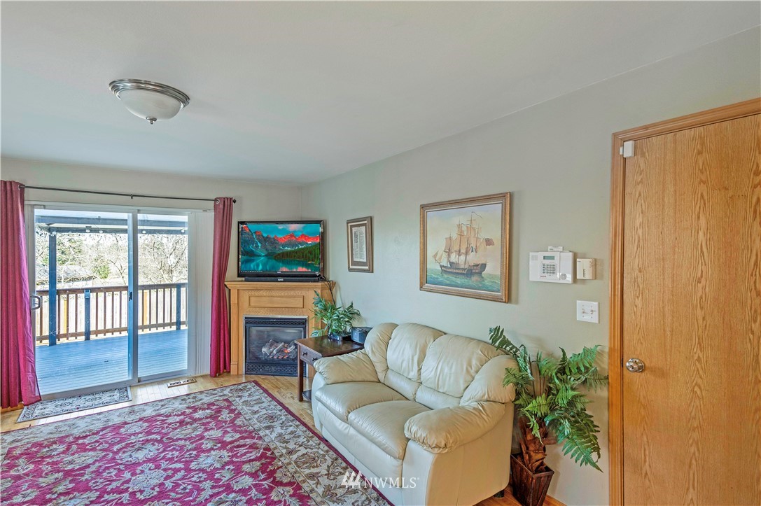 4139 Track Street Bellingham, WA 98226 - Photo 12 of 40 a living room with furniture fireplace and window
