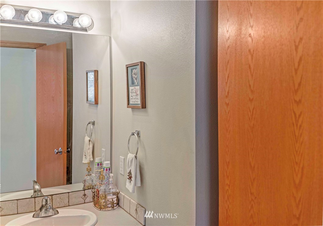 4139 Track Street Bellingham, WA 98226 - Photo 14 of 40 a bathroom with a mirror and a shower