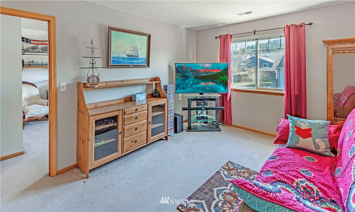 4139 Track Street Bellingham, WA 98226 - Photo 17 of 40 a living room with furniture and a flat screen tv