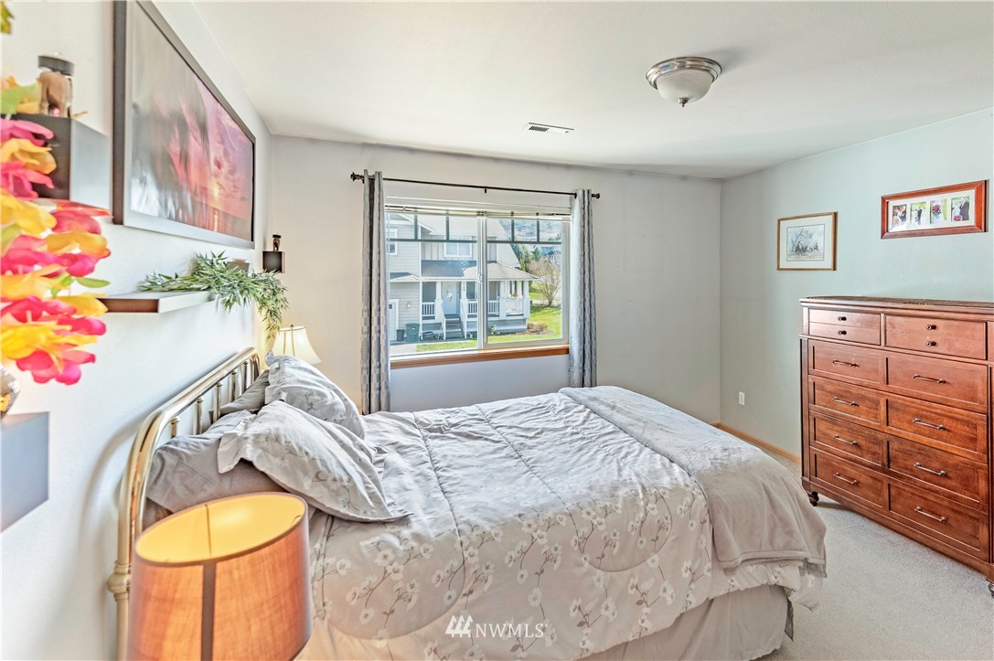 4139 Track Street Bellingham, WA 98226 - Photo 26 of 40 a bed sitting in a bedroom next to a window