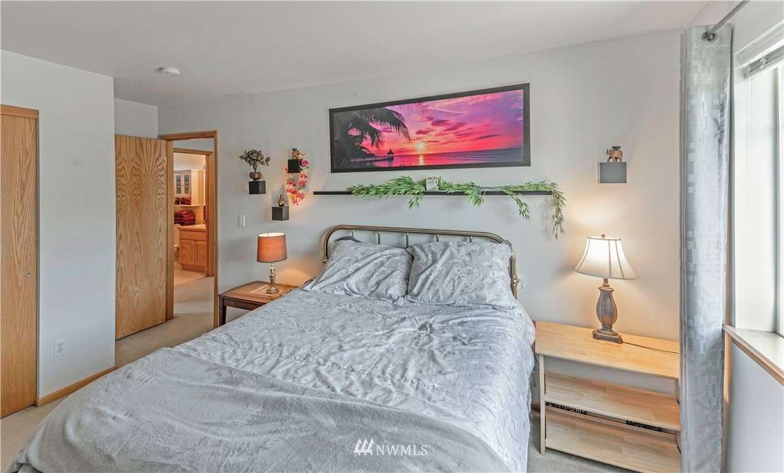 4139 Track Street Bellingham, WA 98226 - Photo 27 of 40 a bedroom with a bed and a painting on the wall