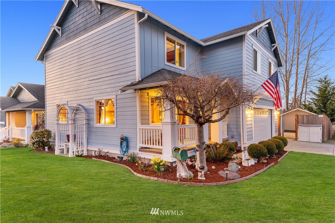 4139 Track Street Bellingham, WA 98226 - Photo 30 of 40 a front view of a house with a yard table and chairs