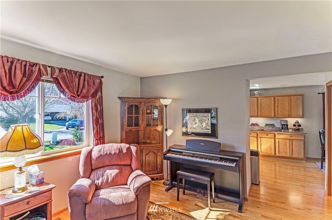 4139 Track Street Bellingham, WA 98226 - Photo 6 of 40 a living room with furniture a fireplace and a flat screen tv