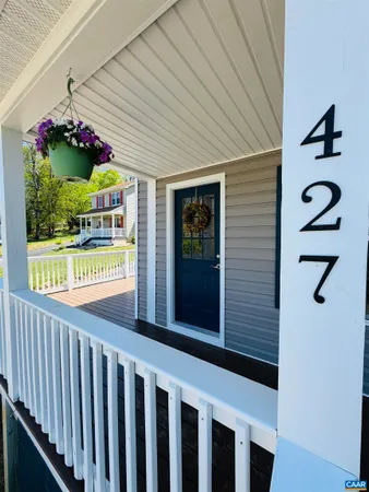 a front view of a house with a porch