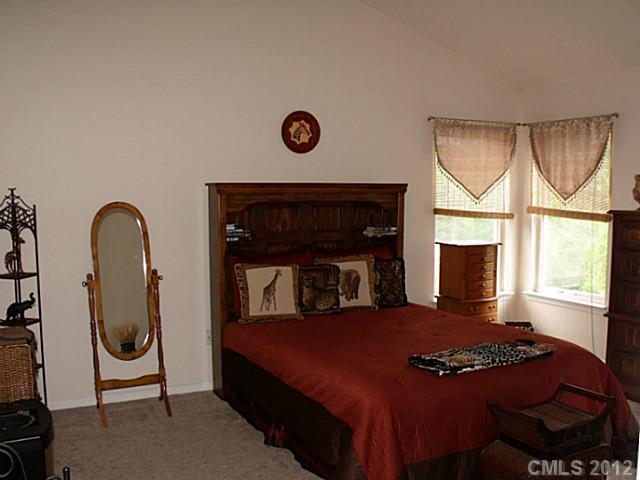 189 Mott Road Mooresville, NC 28115 - Photo 11 of 16 a bedroom with a bed and a window