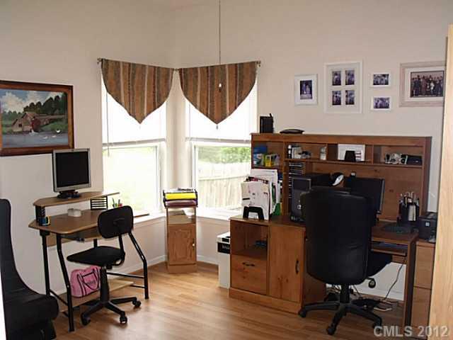 189 Mott Road Mooresville, NC 28115 - Photo 6 of 16 a view of a workspace with furniture and a window
