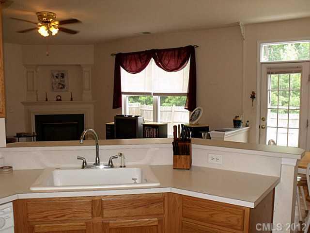 189 Mott Road Mooresville, NC 28115 - Photo 8 of 16 a kitchen with a sink cabinets and window