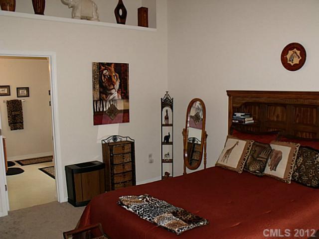 189 Mott Road Mooresville, NC 28115 - Photo 10 of 16 a bedroom with a bed and a table in it