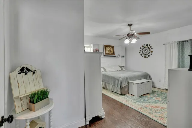 a room with a bed and a chandelier