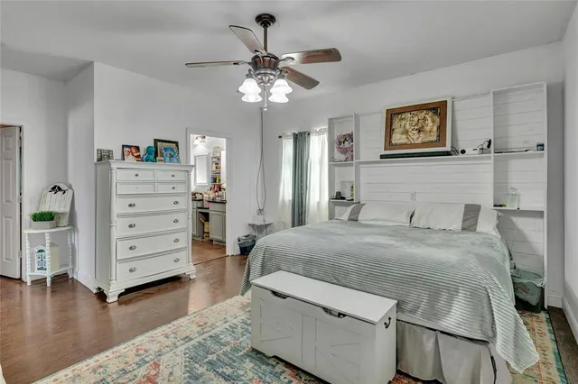 a bedroom with a bed and a dresser
