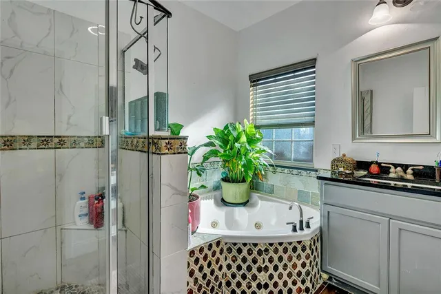 a kitchen with a refrigerator and a stove top oven
