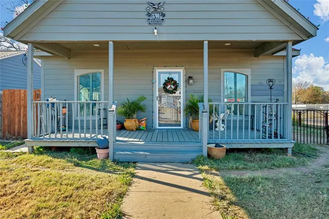 an outdoor view of house with swimming pool and furniture