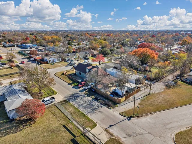 a city street filled with lots of traffic and tall buildings