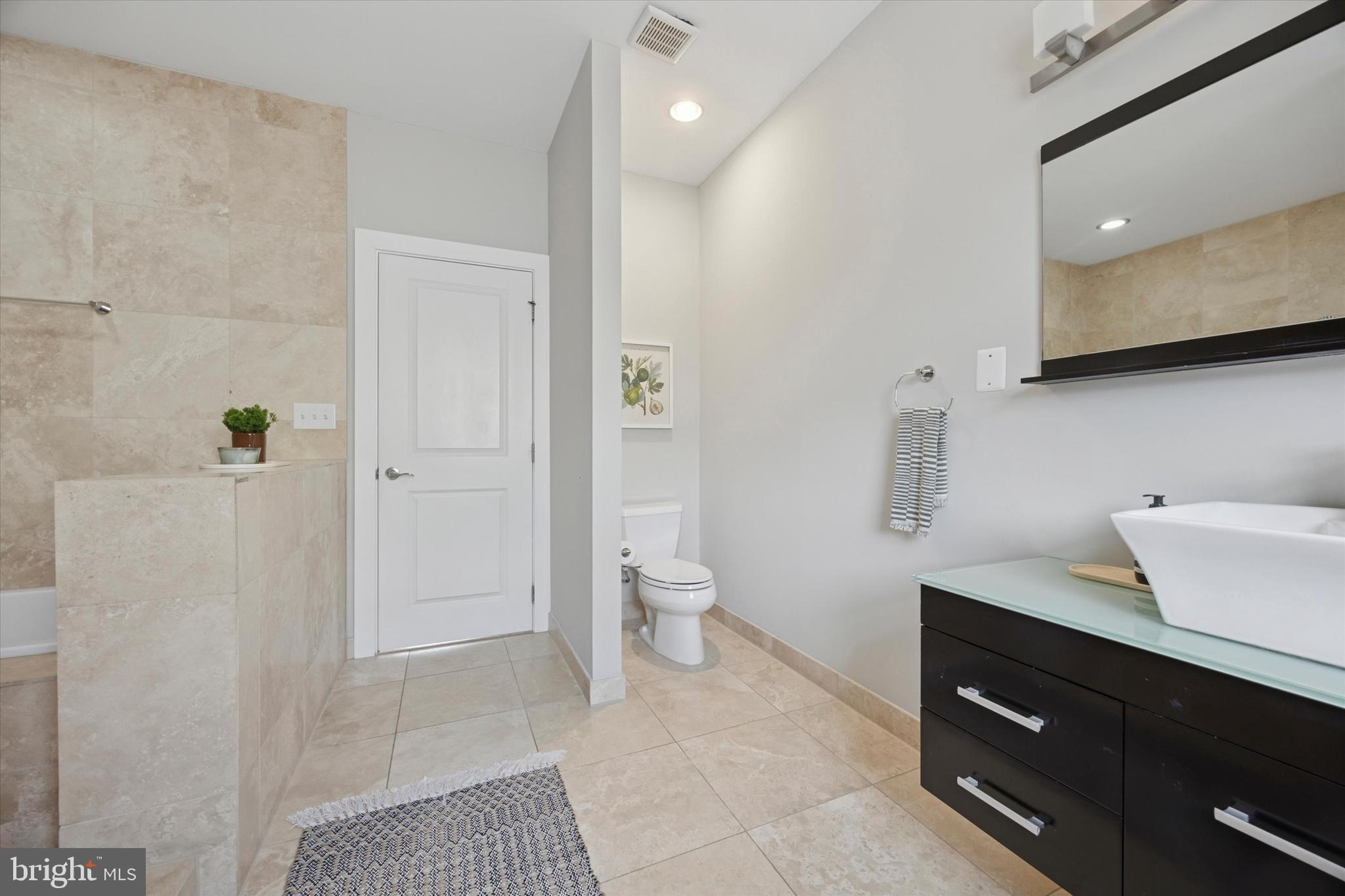 1639 Francis Street Philadelphia, PA 19130 - Photo 17 of 21 a bathroom with a sink a toilet and shower
