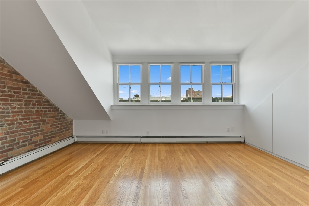 71 Rutland Street, Unit 4 Boston, MA 02118 - Photo 19 of 35 a view of a kitchen with wooden floor and a sink