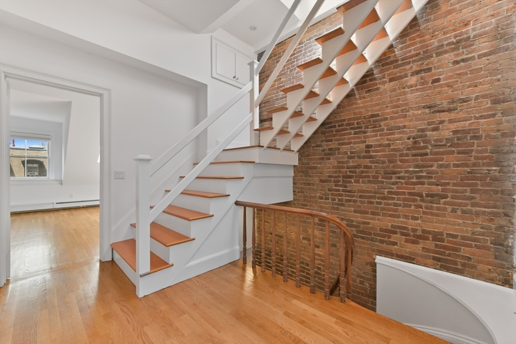 71 Rutland Street, Unit 4 Boston, MA 02118 - Photo 23 of 35 a view of entryway with wooden floor and stairs