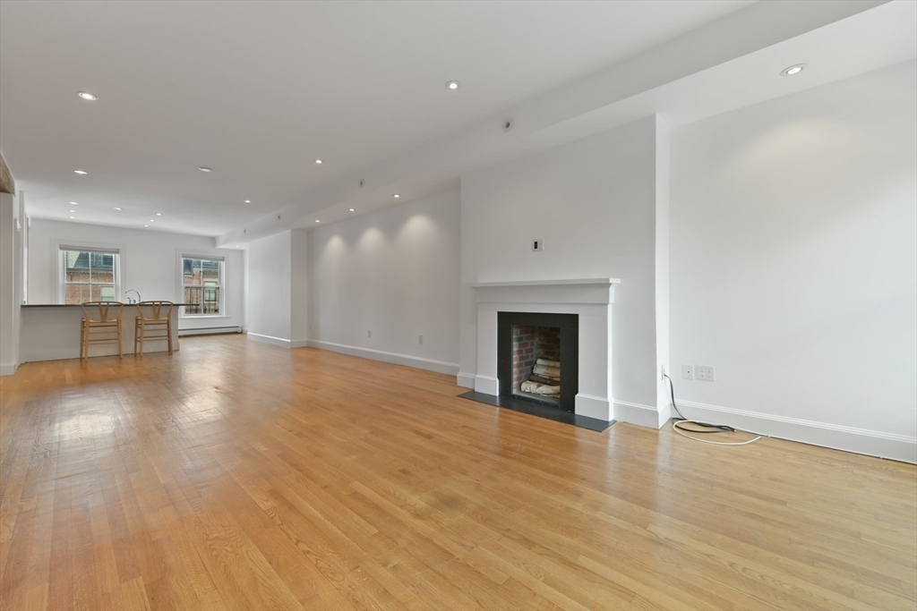 71 Rutland Street, Unit 4 Boston, MA 02118 - Photo 5 of 35 a view of a livingroom with a fireplace