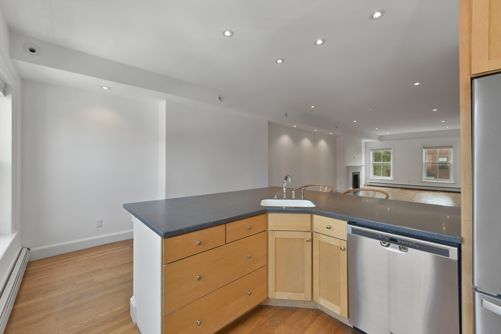 71 Rutland Street, Unit 4 Boston, MA 02118 - Photo 8 of 35 a kitchen with a sink stove and cabinets