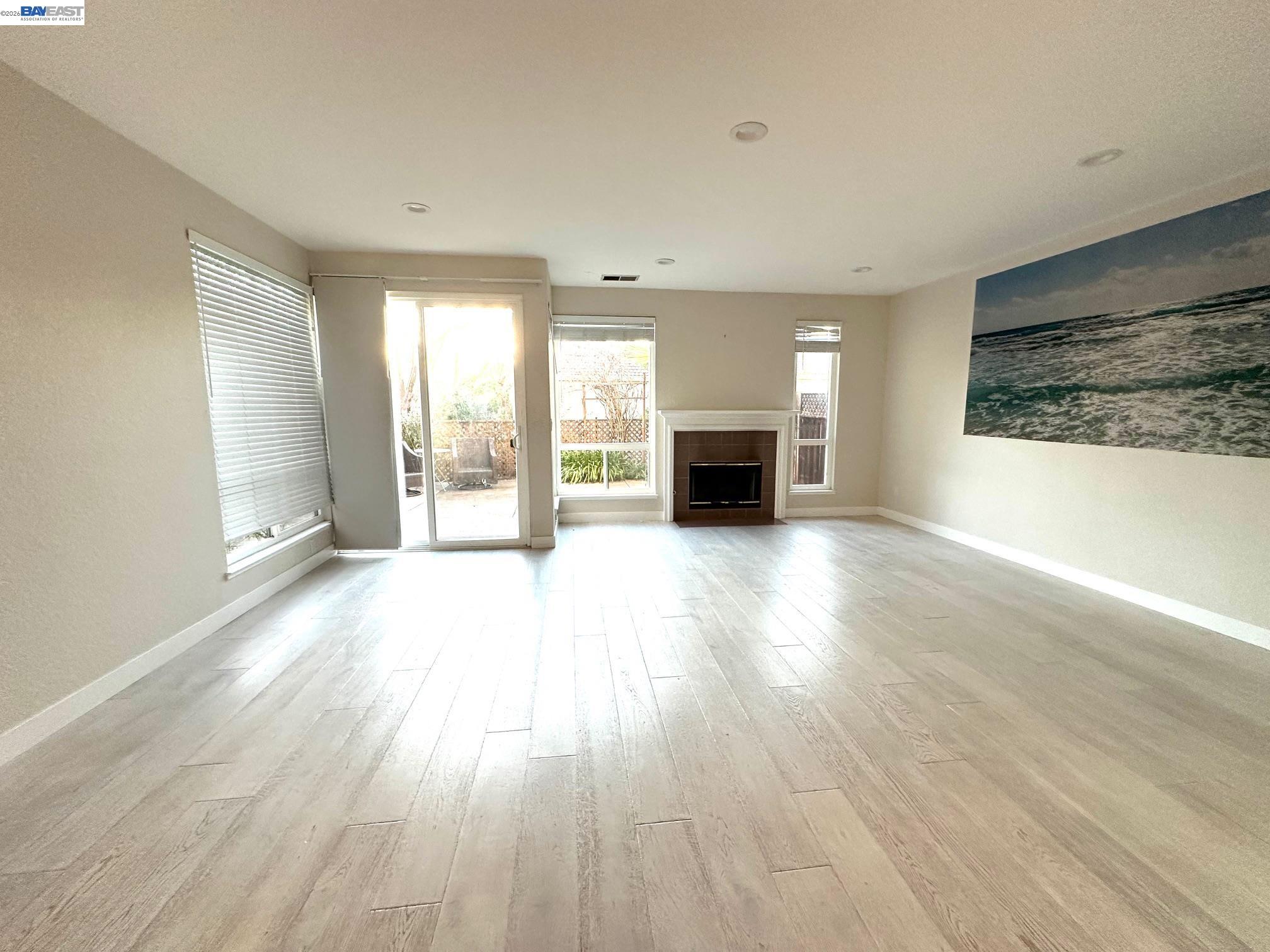 912 Vista Pointe Drive San Ramon, CA 94582 - Photo 2 of 13 a view of an empty room with wooden floor and a window