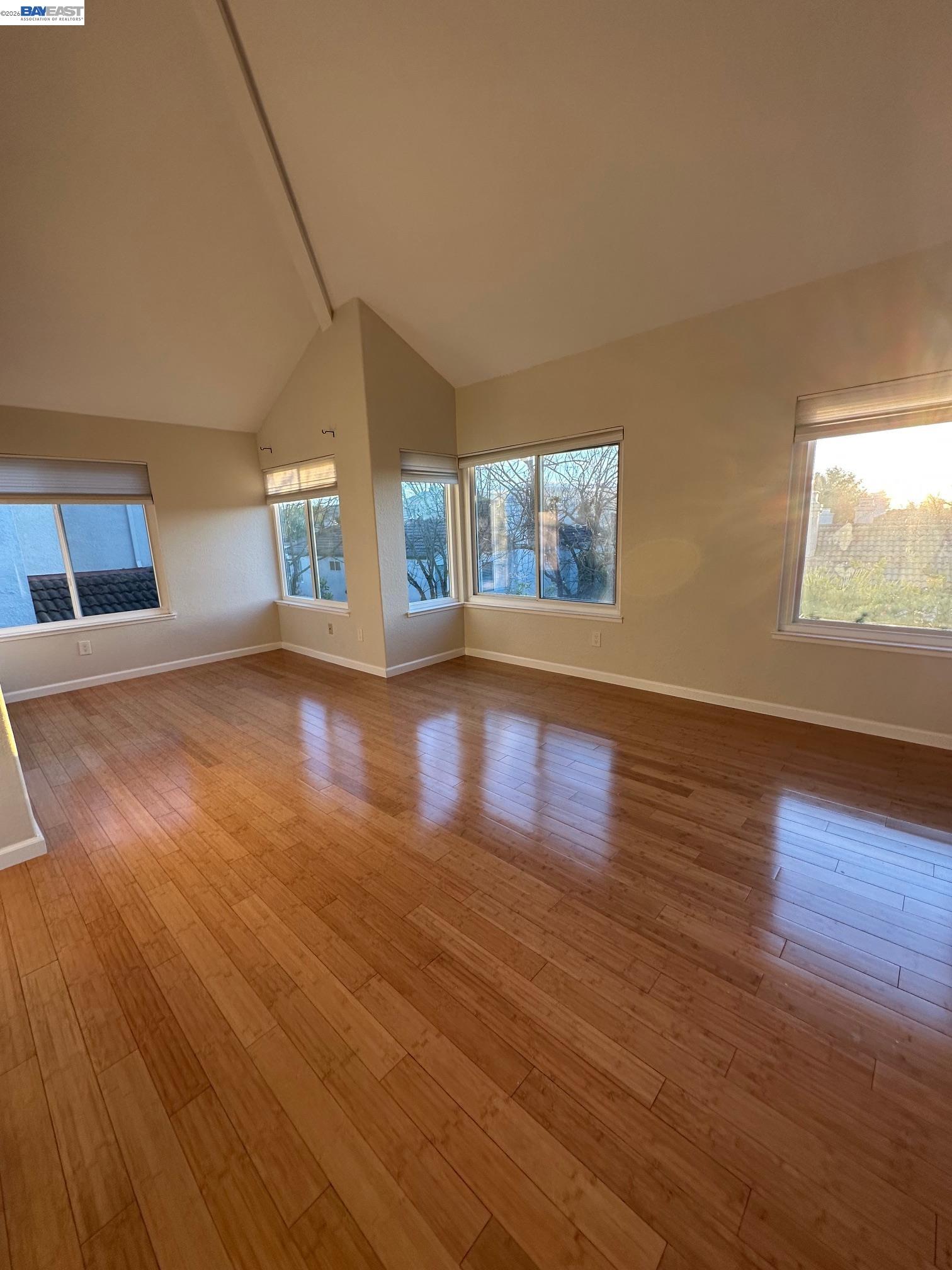 912 Vista Pointe Drive San Ramon, CA 94582 - Photo 6 of 13 a view of an empty room with wooden floor and a window