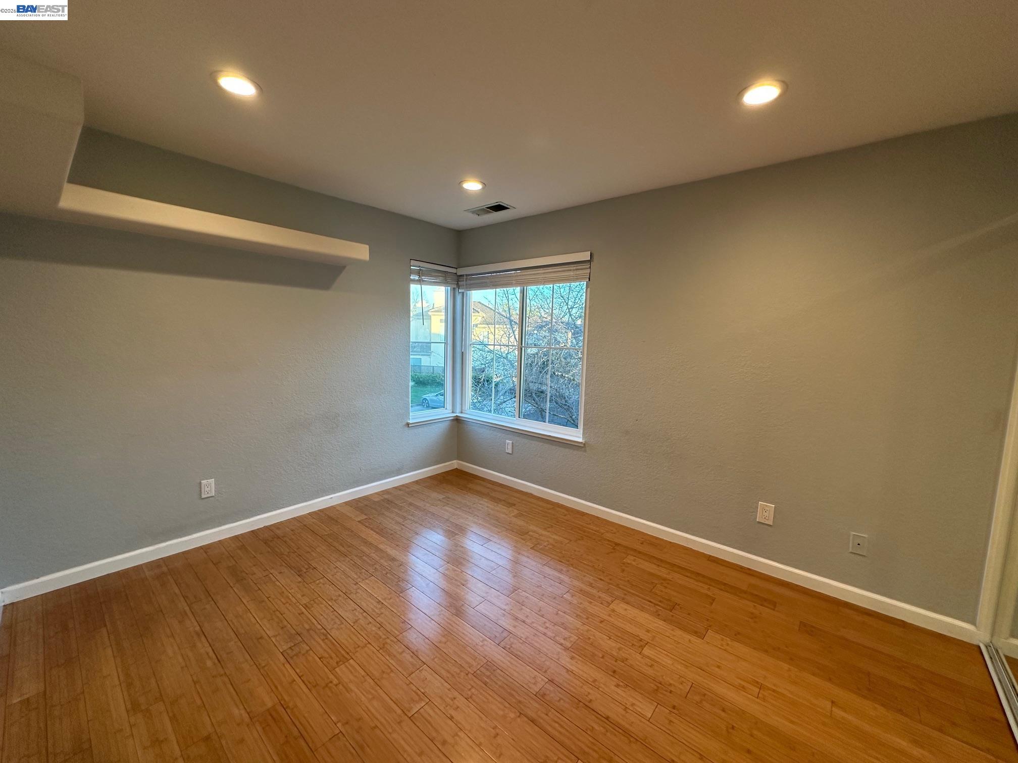 912 Vista Pointe Drive San Ramon, CA 94582 - Photo 9 of 13 an empty room with wooden floor and windows