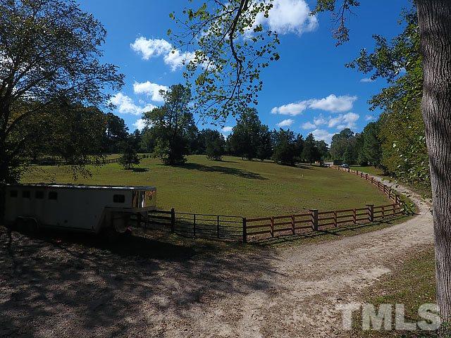 9100 Honeycutt Road Raleigh, NC 27615 - Photo 3 of 25 a view of a golf course with a lake