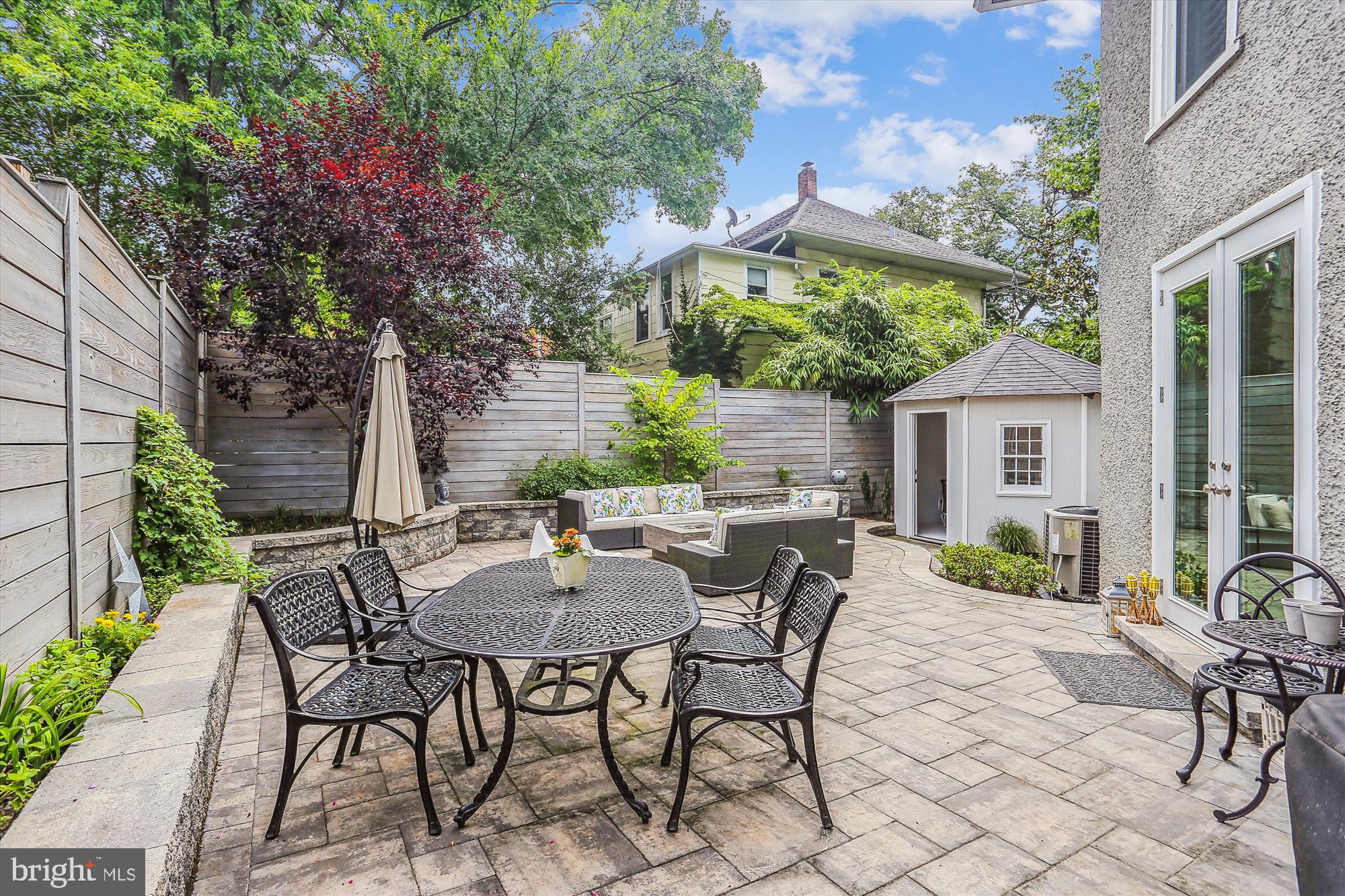 4887 MacArthur Boulevard Northwest Washington, DC 20007 - Photo 14 of 21 Back patio with artist gazebo