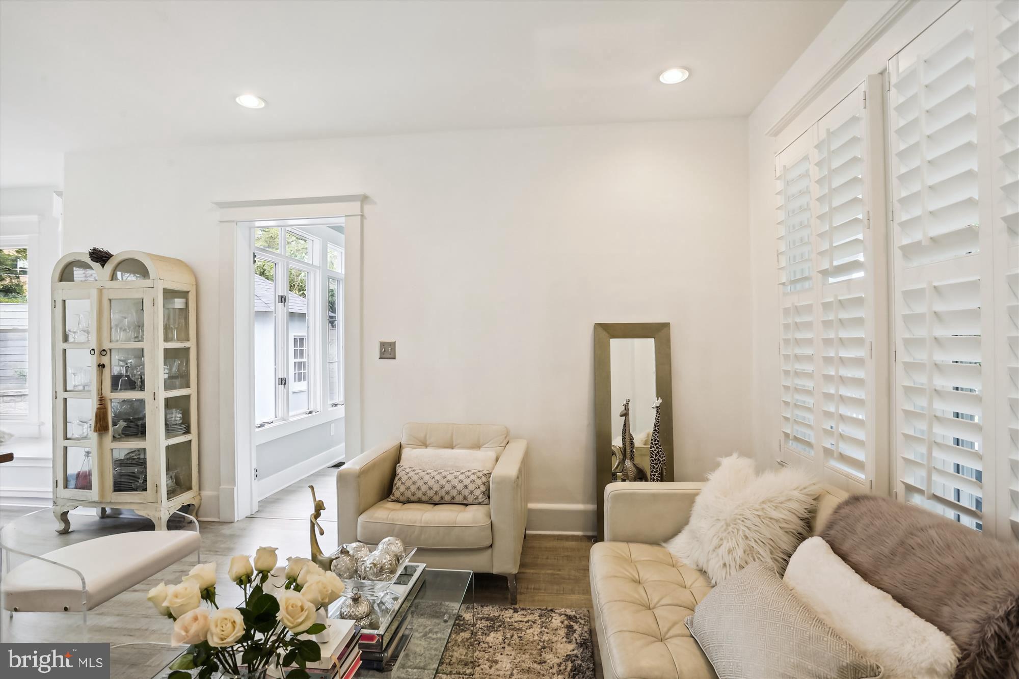 4887 MacArthur Boulevard Northwest Washington, DC 20007 - Photo 4 of 21 Living Room has fabulous shutters