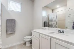 a bedroom with a bed and a cabinets