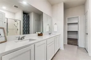 a bedroom with a bed and a cabinets