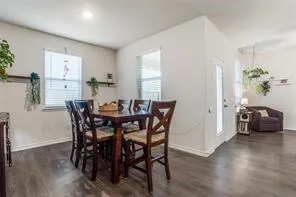 a kitchen with a sink a counter top space stainless steel appliances and cabinets