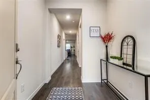 a view of a hallway view with staircase