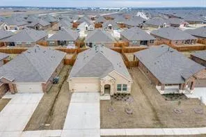 a view of an empty room with wooden floor and closet