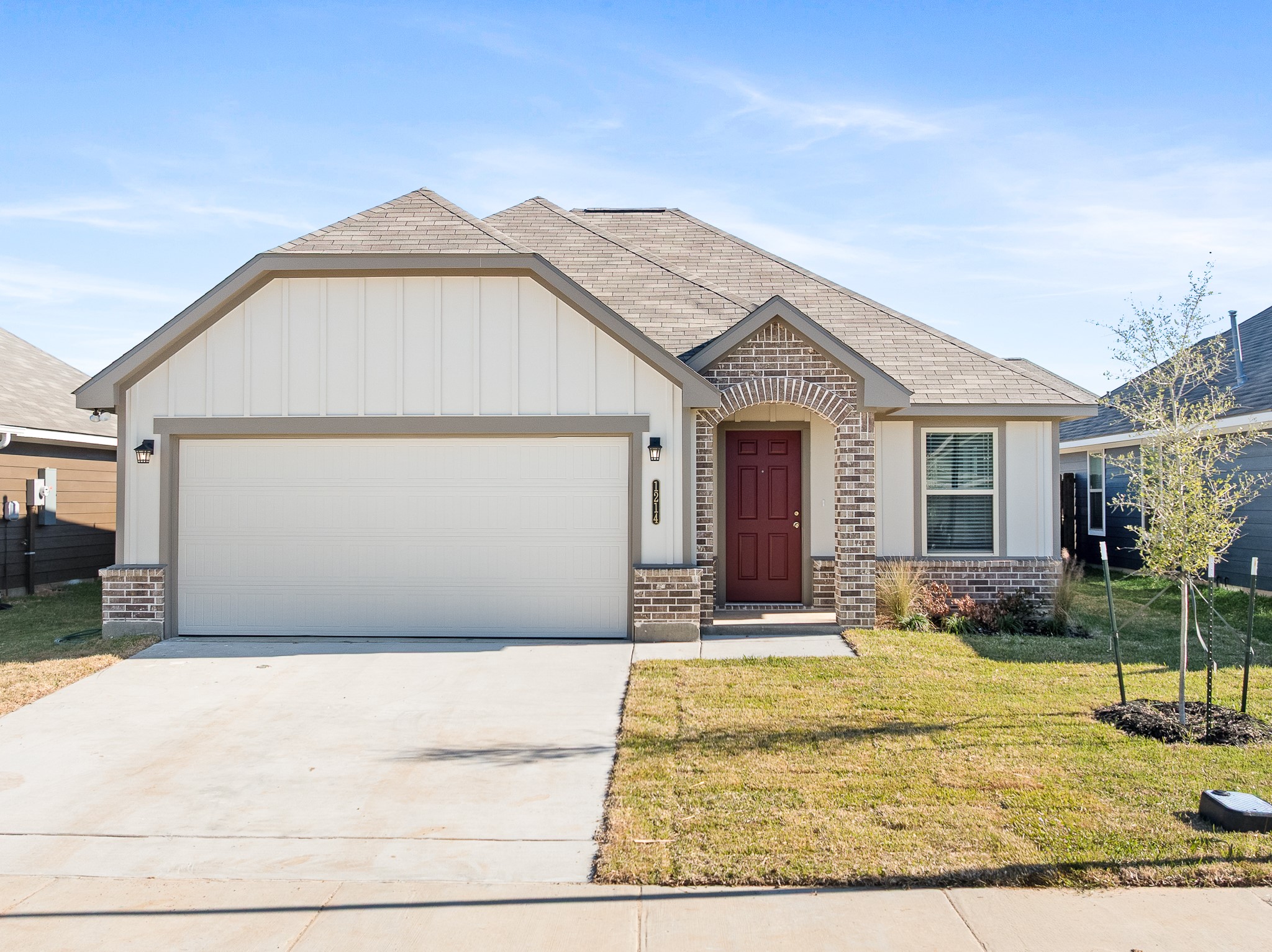 1214 High Street Navasota, TX 77868 - Photo 1 of 28 a front view of a house with garden