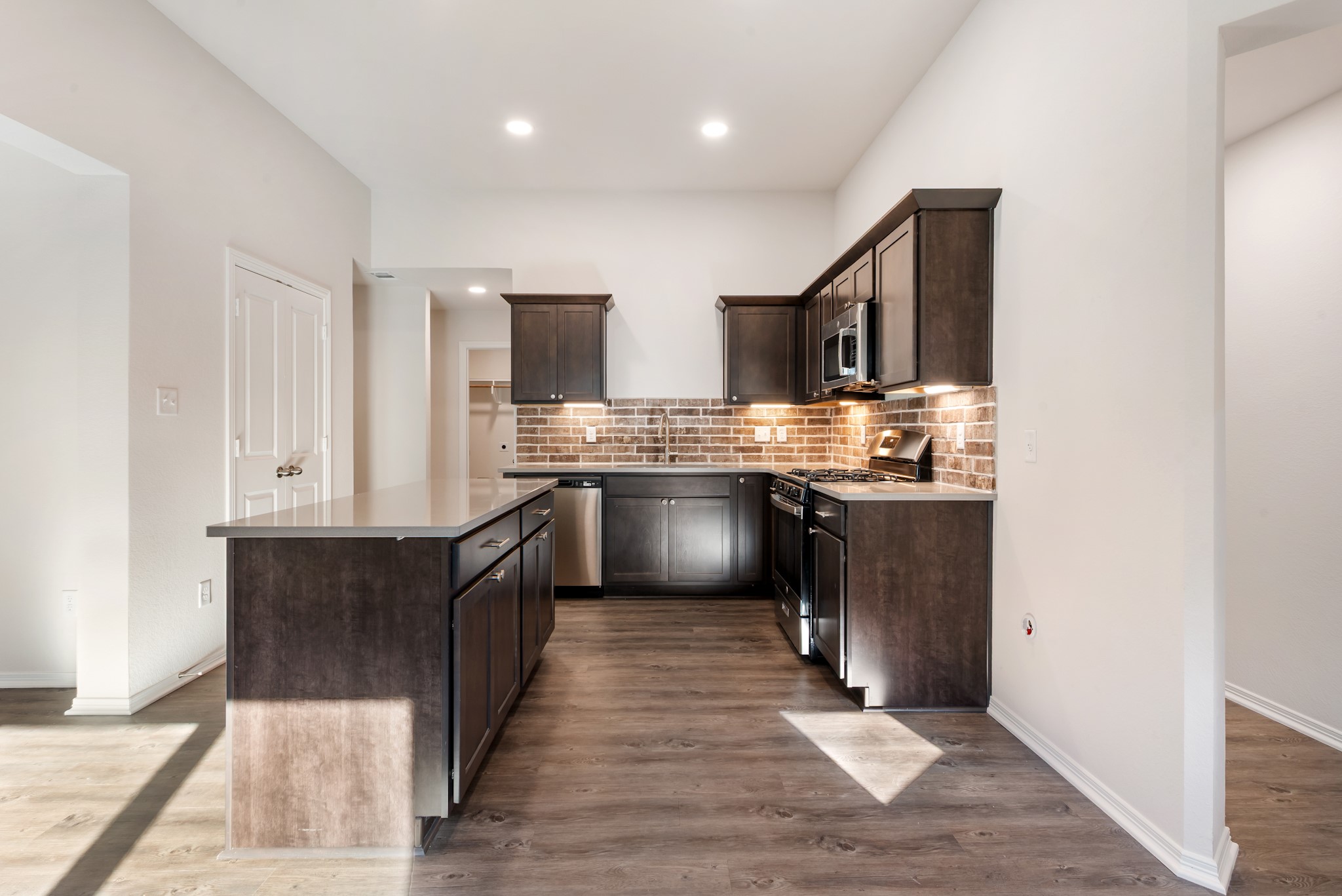 1214 High Street Navasota, TX 77868 - Photo 11 of 28 a kitchen with stainless steel appliances granite countertop a stove top oven and sink