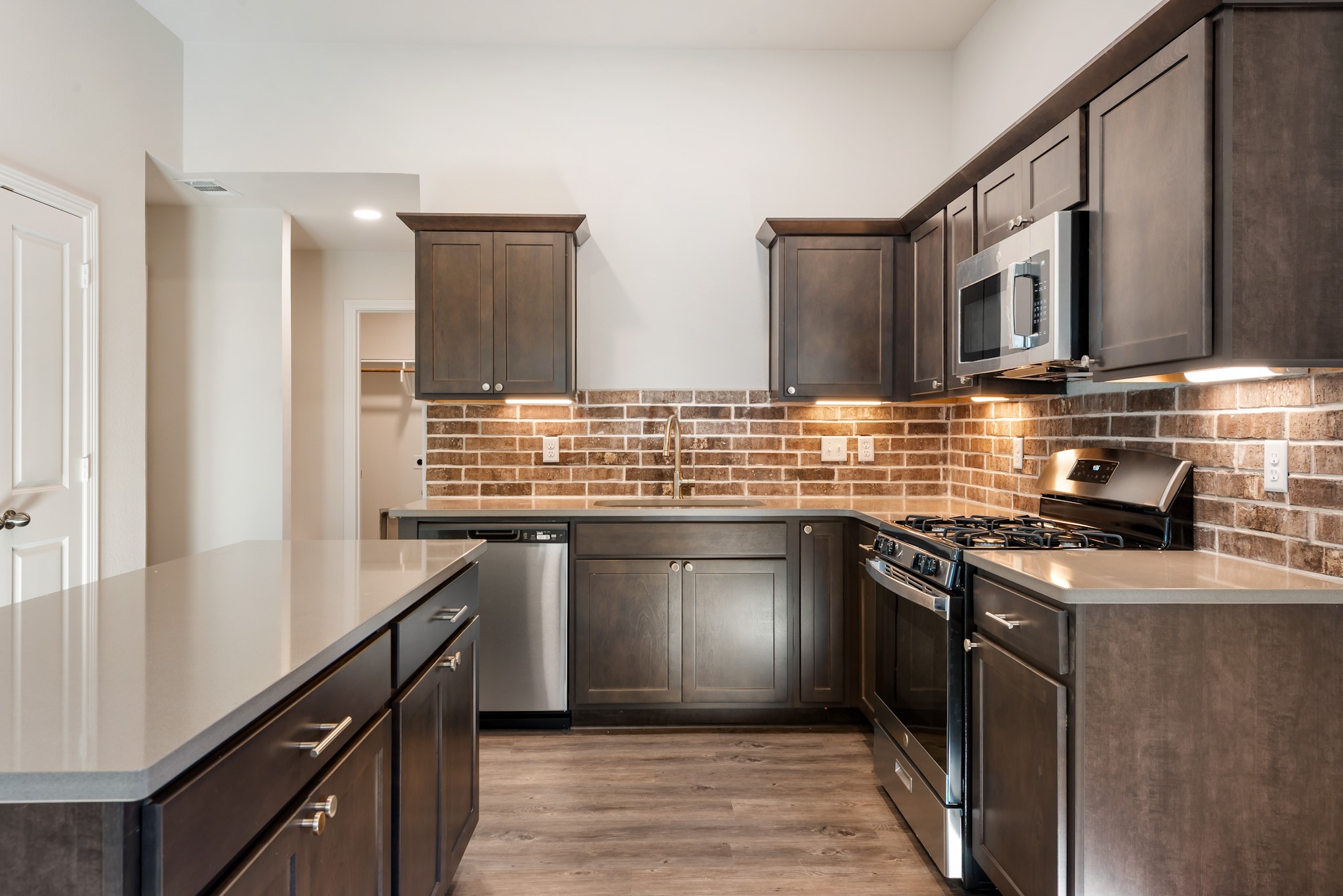 1214 High Street Navasota, TX 77868 - Photo 12 of 28 a kitchen with stainless steel appliances granite countertop a sink stove and refrigerator