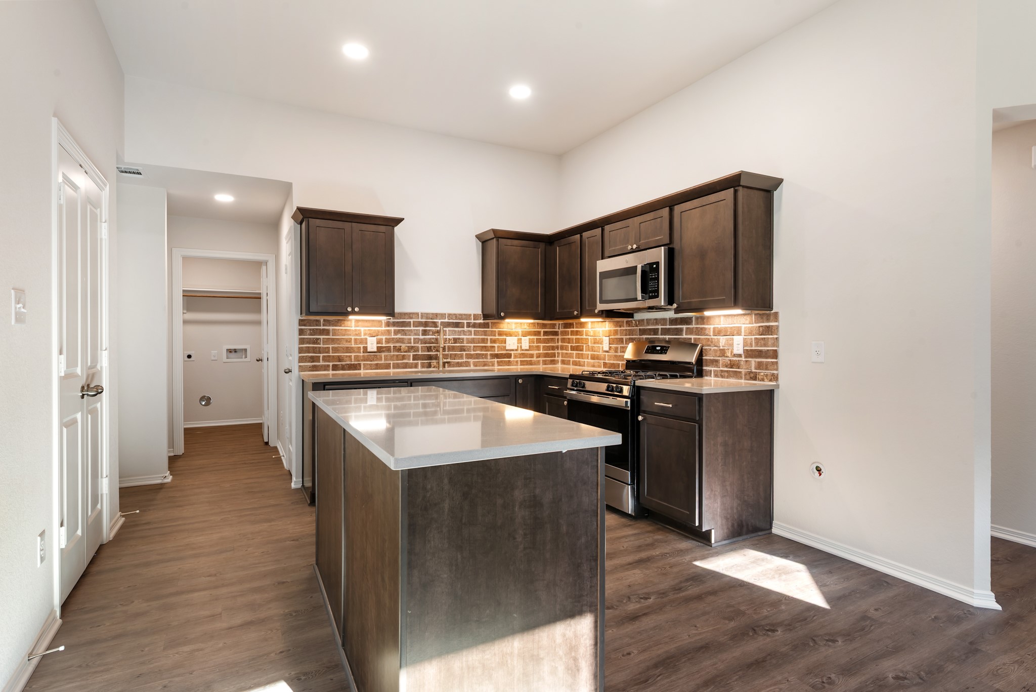 1214 High Street Navasota, TX 77868 - Photo 13 of 28 a kitchen with stainless steel appliances granite countertop a sink stove and refrigerator