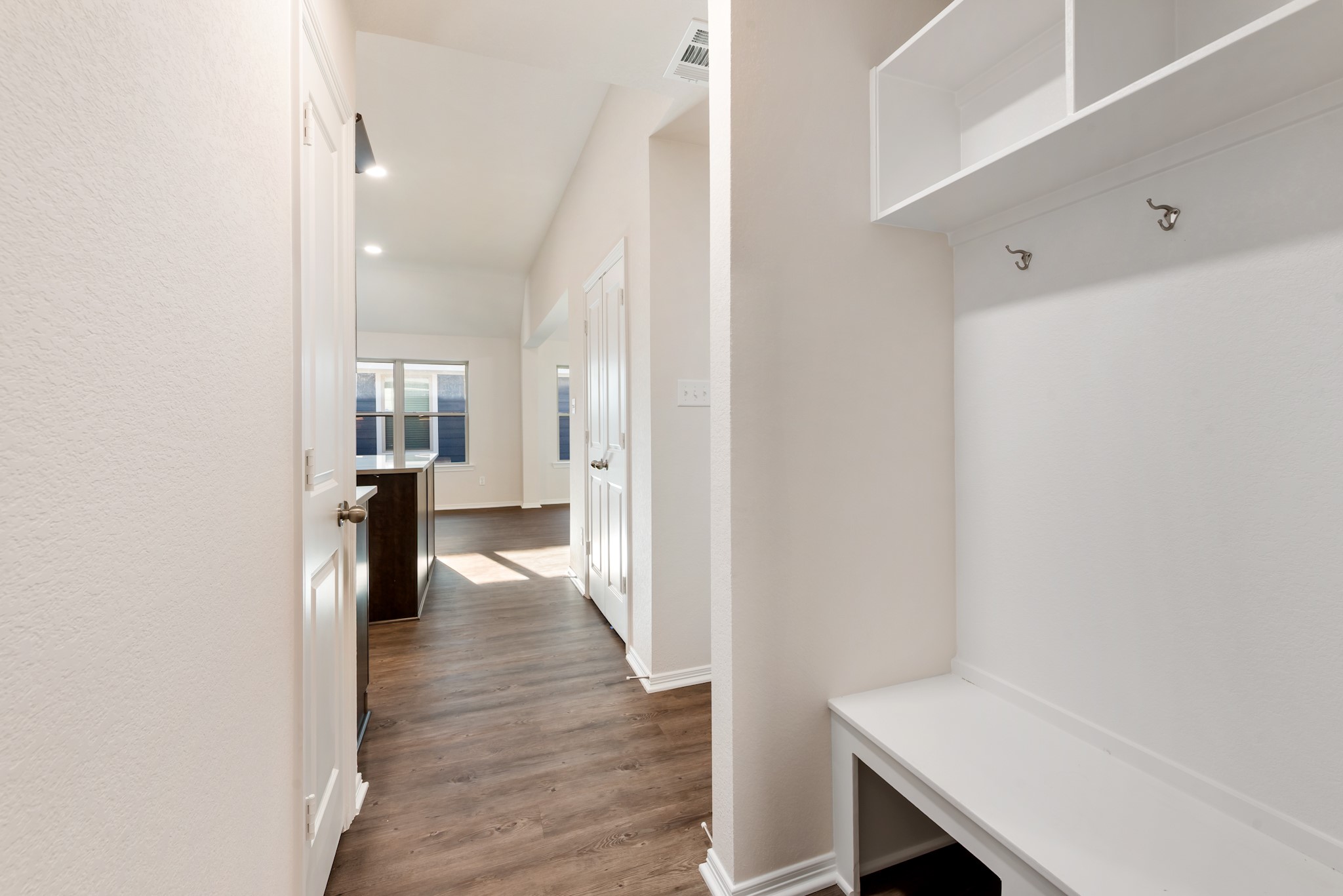 1214 High Street Navasota, TX 77868 - Photo 17 of 28 a view of a hallway with wooden floor and closet