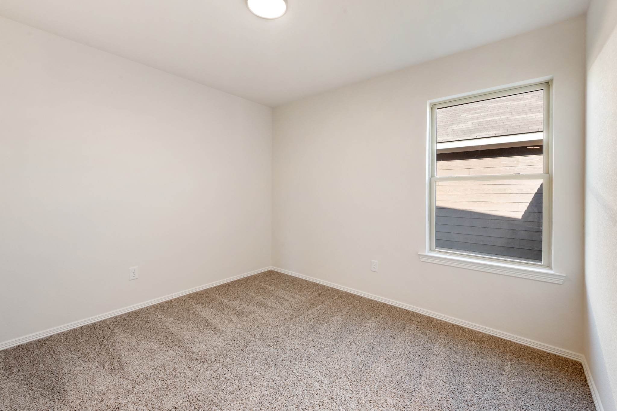 1214 High Street Navasota, TX 77868 - Photo 18 of 28 a view of an empty room with a window