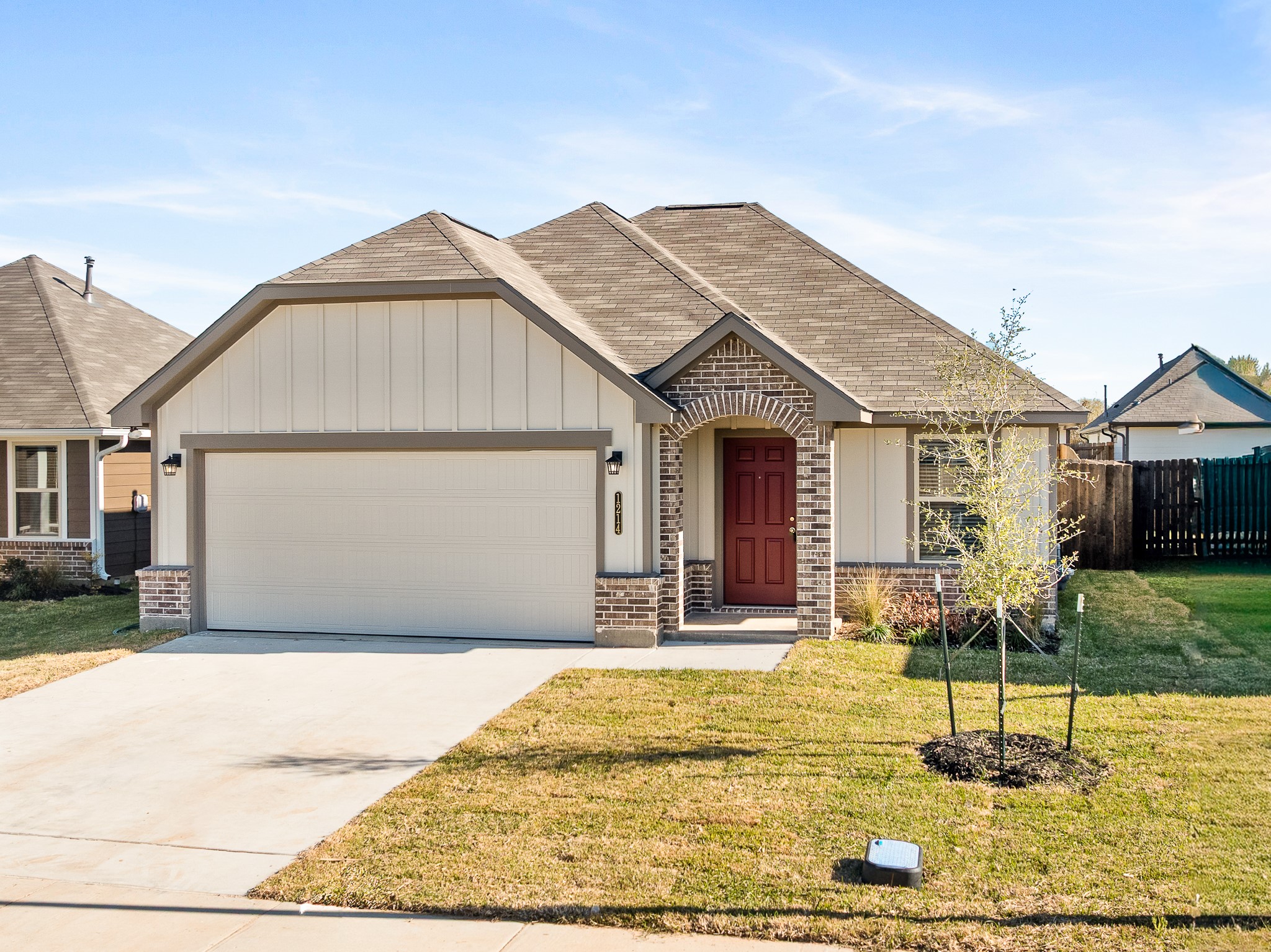 1214 High Street Navasota, TX 77868 - Photo 2 of 28 a front view of a house with garden